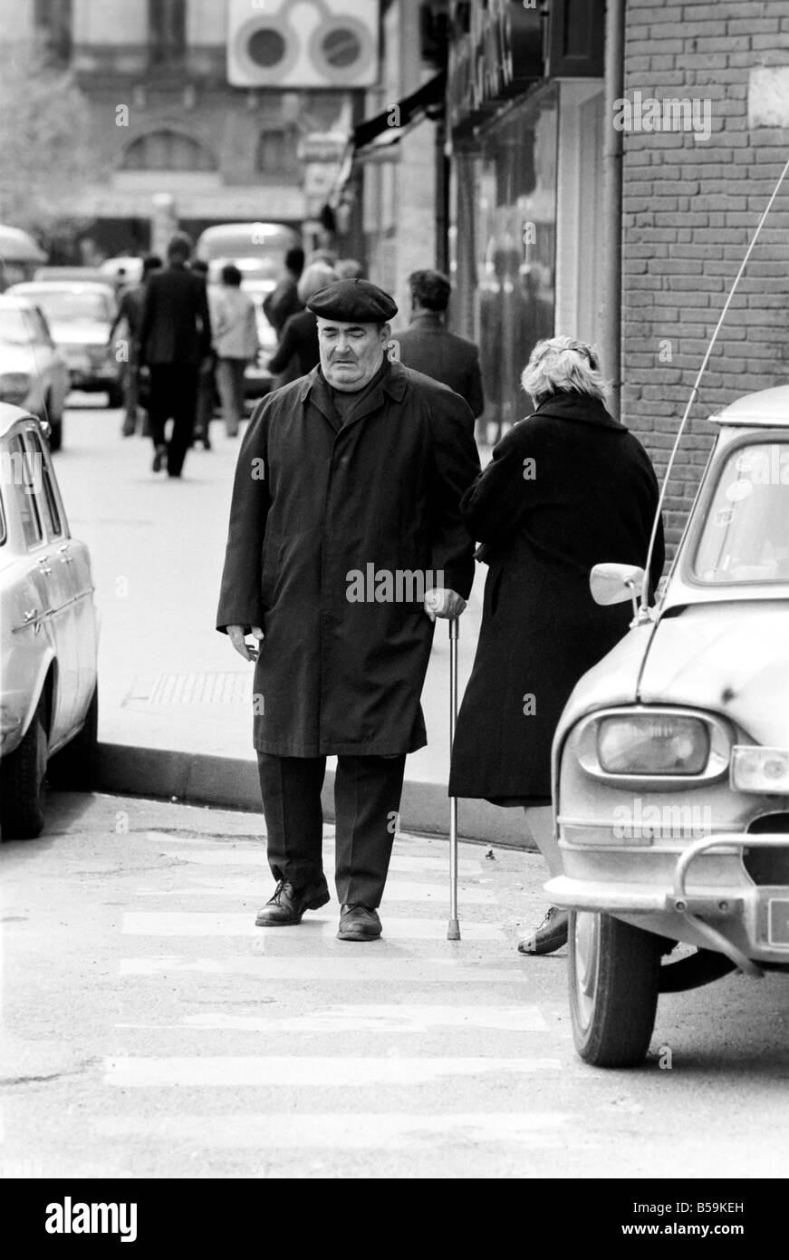 A man in a French town walking down the street&#13;&#10;April 1975 &#13;&#10;75-2078-013 Stock Photo