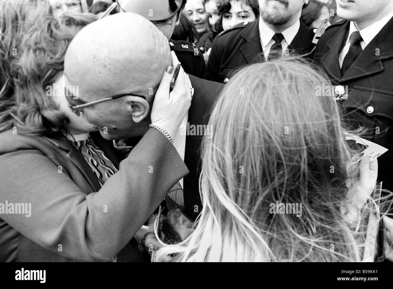American actor Telly Savalas who plays Kojak in the television series is greeted by a large crowd before being interviewed at Ca Stock Photo