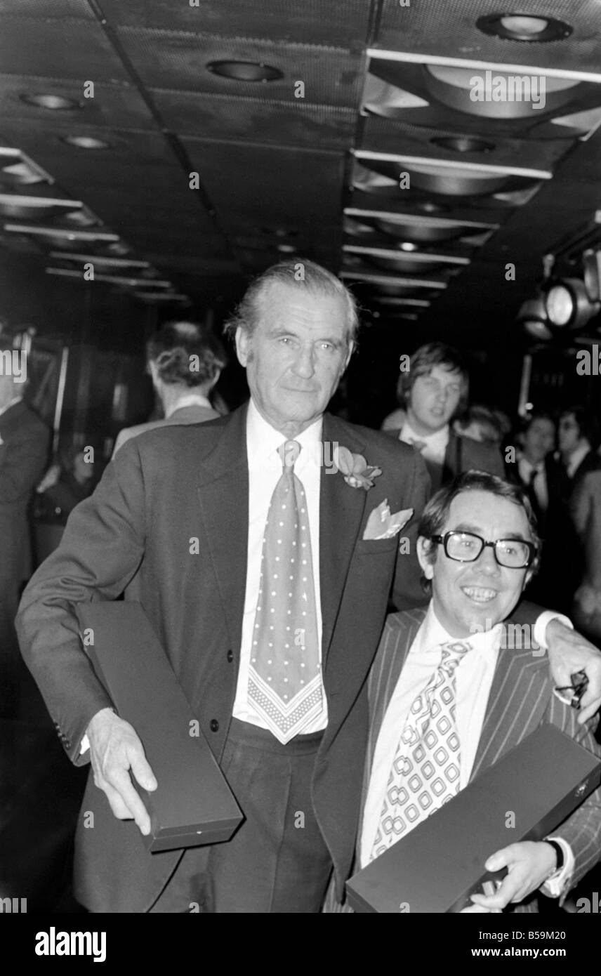 The Marquis of Bath with comedian Ronnie Corbett holding their awards at the Tie Manufacturers Association Top Ten Tie men contest of Great Britain;April 1975 ;75-2117-017 Stock Photo