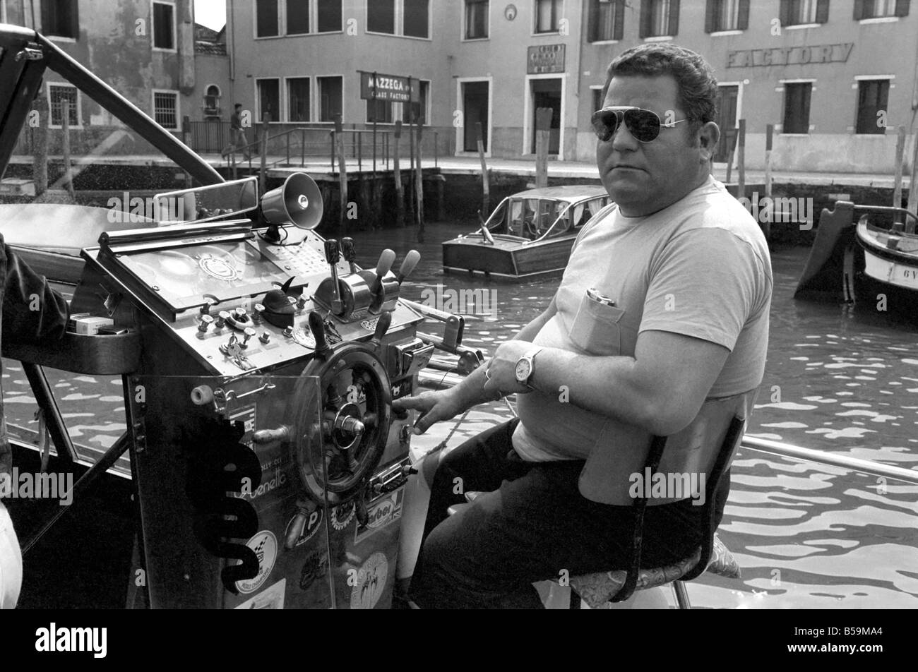 General scenes in Venice. Captain of a water taxi awaits his next fare . April 1975 75-2202-003 Stock Photo