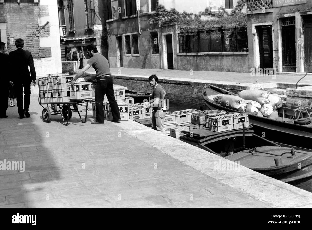 People: Culture: General scenes in Venice.  Beer being delivery to a canal side cafe. April 1975 75-2202-029 Stock Photo