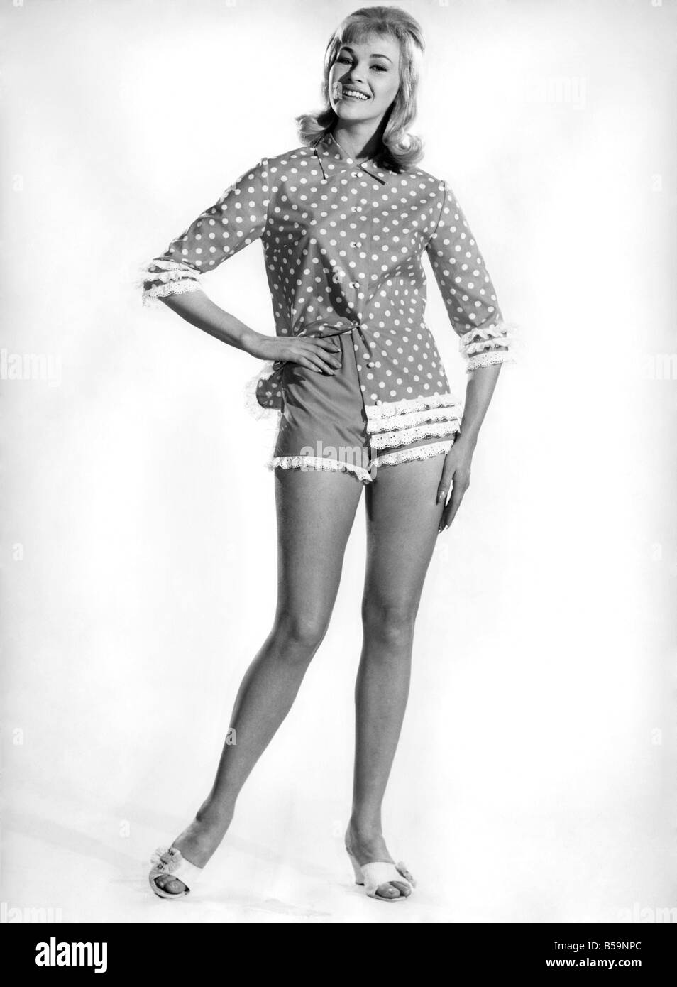 Model Jo Waring wearing a polka dot patterned top and three quarter ...