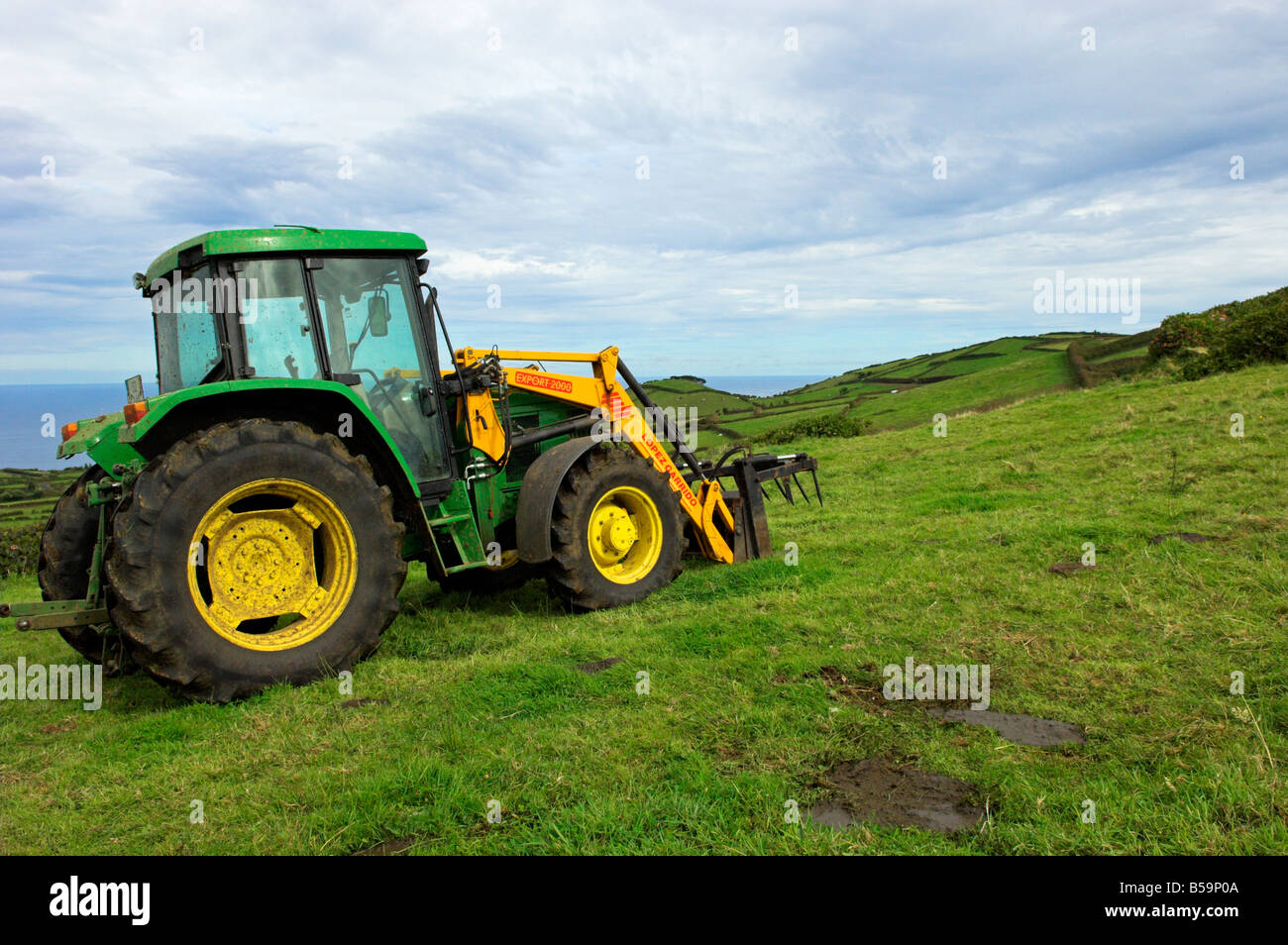 Tractor in field Stock Photo Alamy