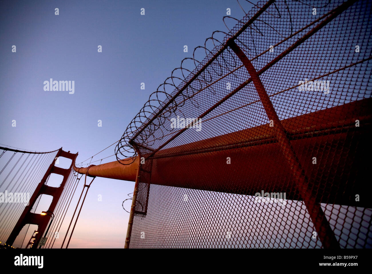 View looking up suspension cable with barbed wire, Golden Gate Bridge Stock Photo