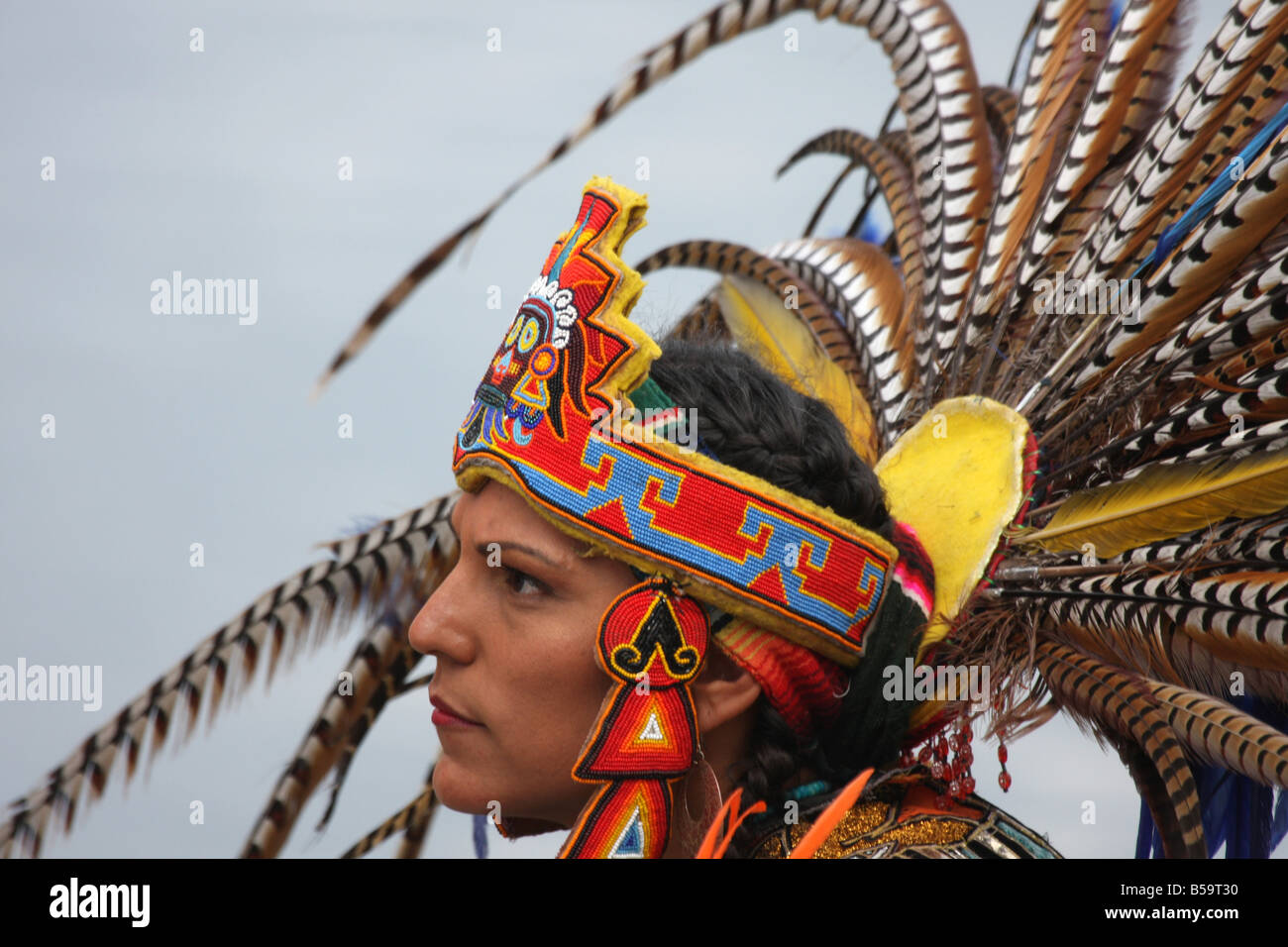 An Incan South American Indian in a fancy feather headdress at the