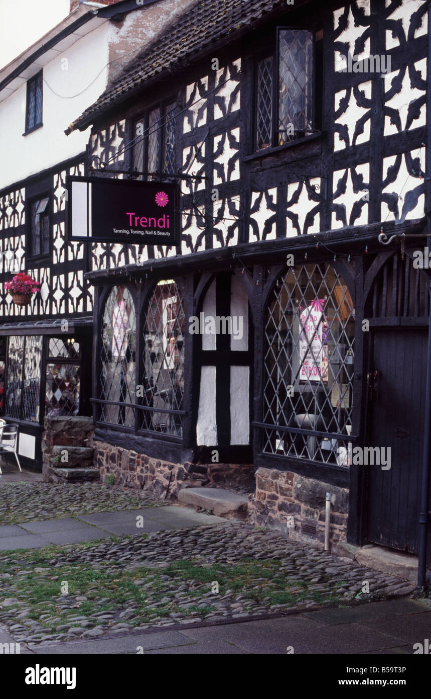 Modern shops — Tanning, Nail and Beauty shop — installed into a classic, early 16th century timber framed building, Welshpool Stock Photo