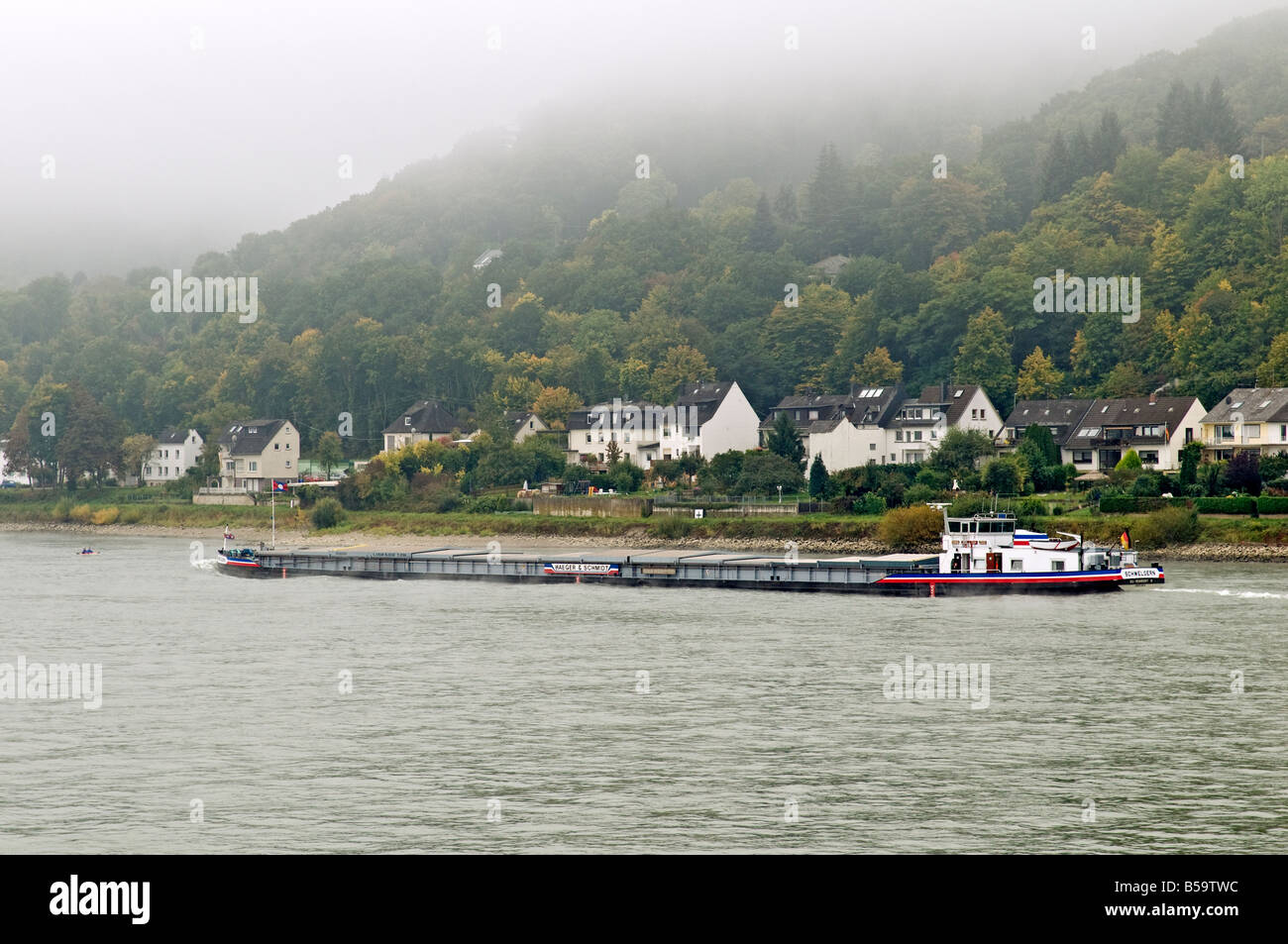 Germany, near Koblenz. Barge on the Rhine on a foggy morning. Stock Photo