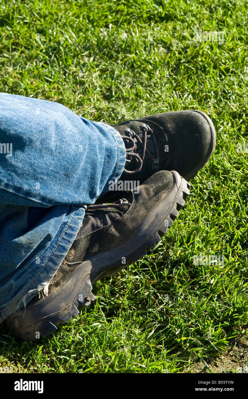 Foot In Boot Man's feet in walking boots Stock Photo - Alamy
