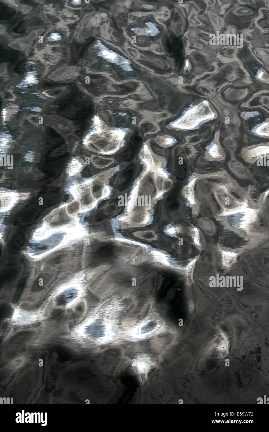 sun light reflection waves on lake water surface Stock Photo - Alamy