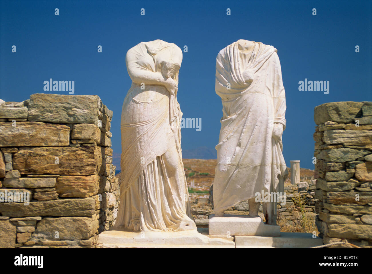 Headless statues of Cleopatra and Dioskovridis, Delos, UNESCO World Heritage Site, Cyclades Islands, Greek Islands, Greece Stock Photo