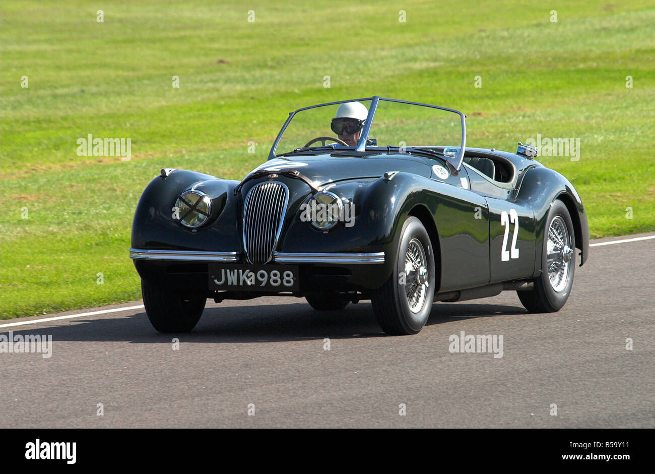 Sir Stirling Moss Racing a 1949 Jaguar XK120 at the Goodwood Revival