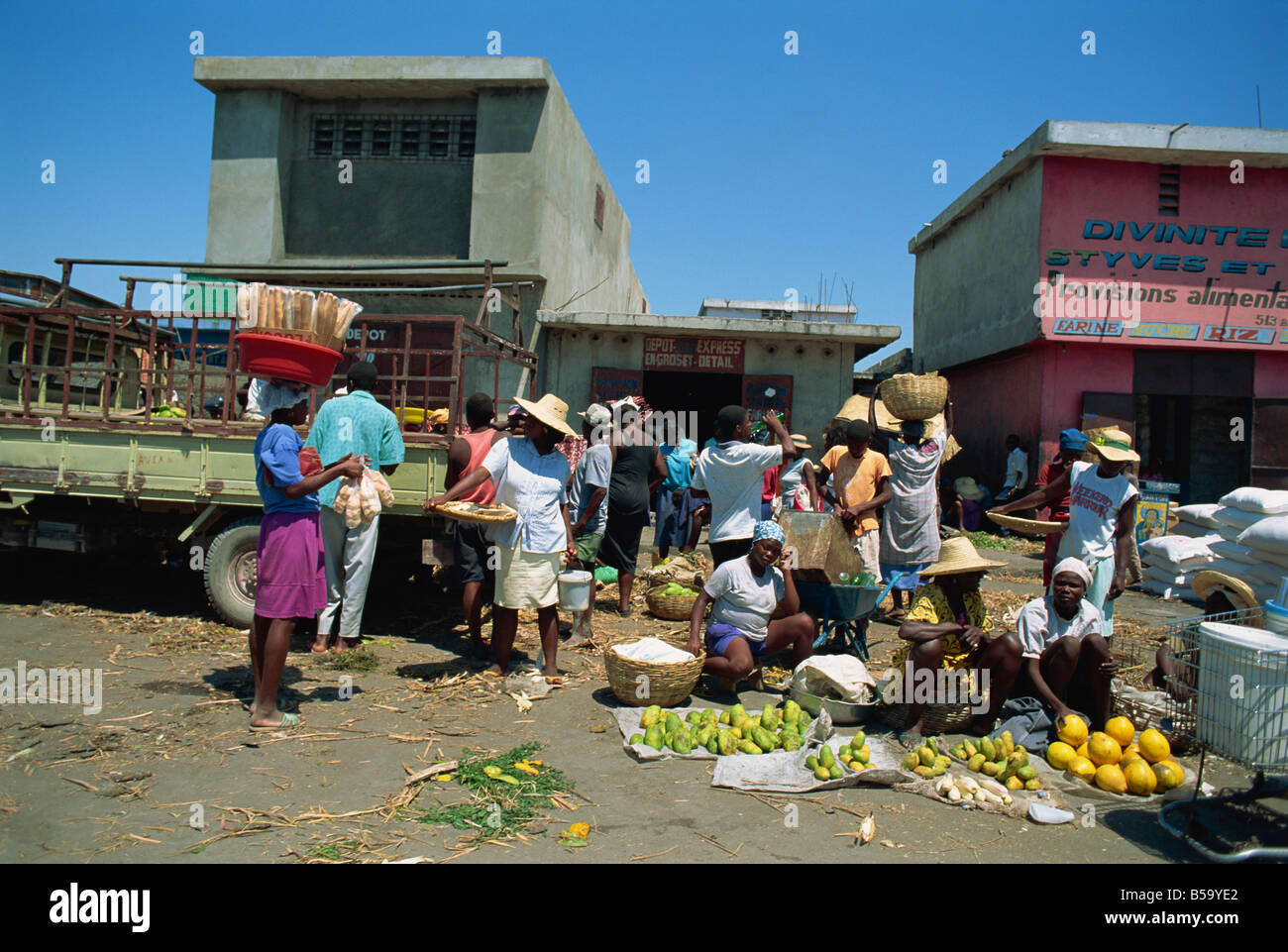 Women selling tropical fruit and bread at the side of the street, Port au Prince, Haiti, West Indies, Central America Stock Photo
