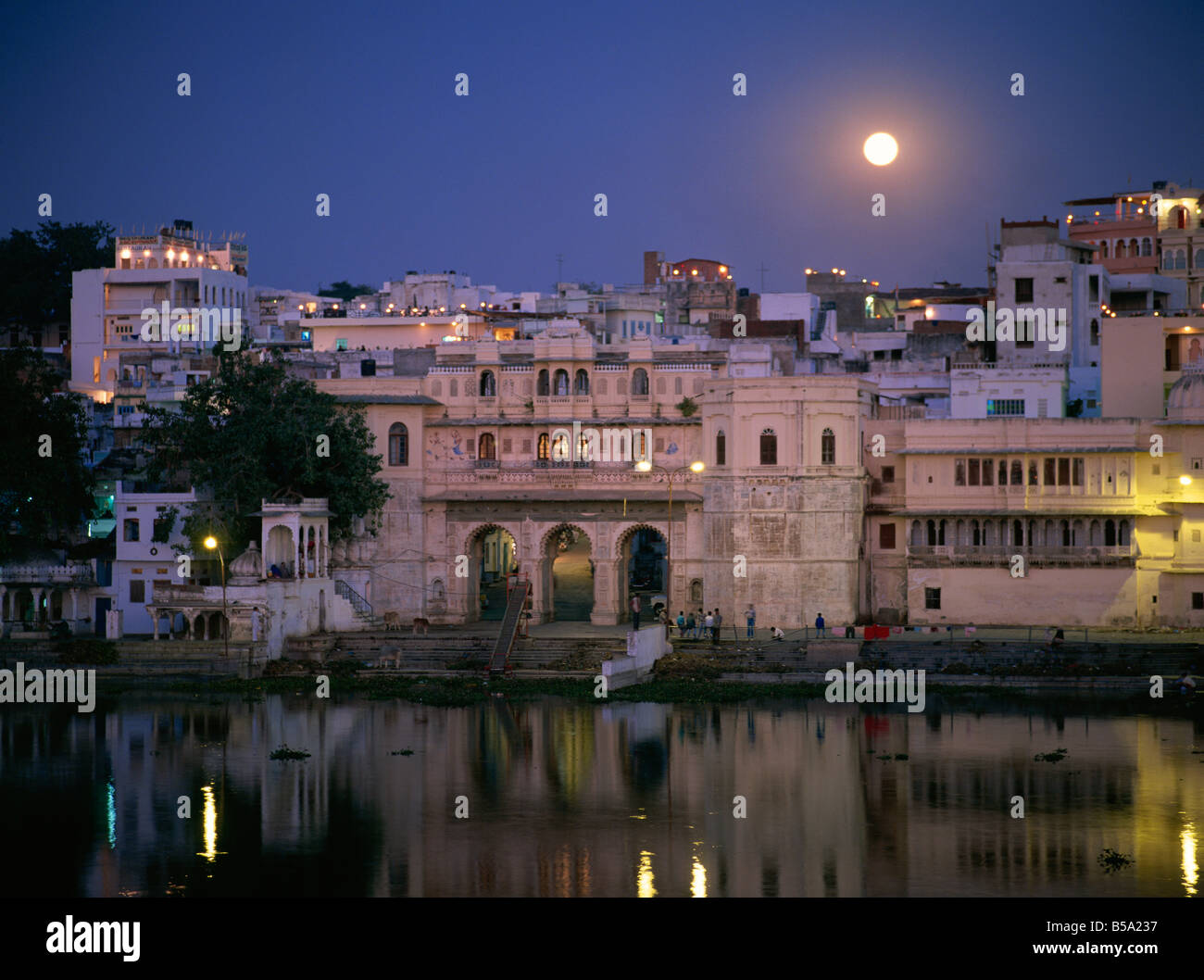 Moonlit view of Gangaur Ghat with old city gateway Udaipur Rajasthan state India Asia Stock Photo