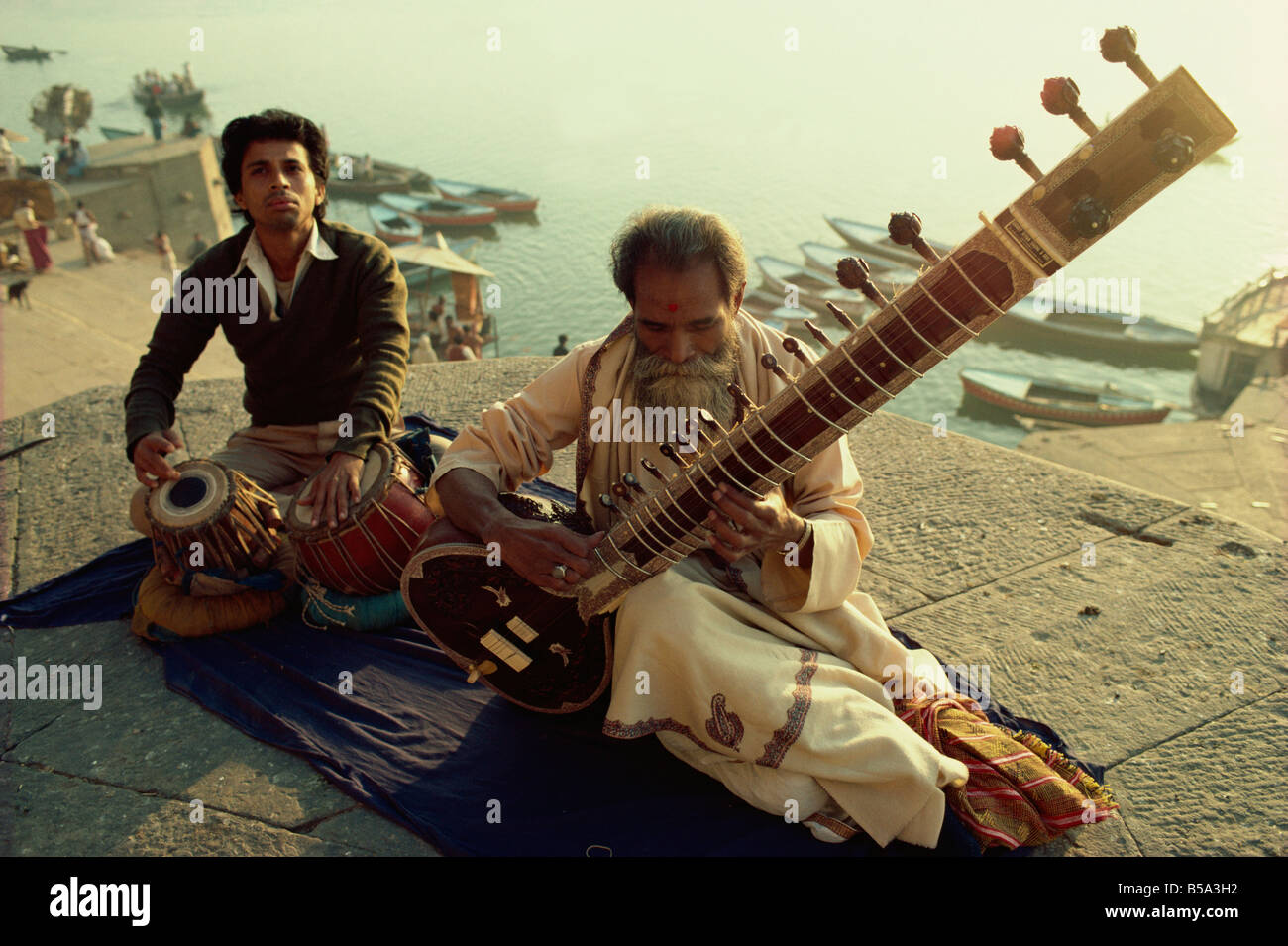 Sitar and tabla player beside the Ganga River Varanasi Uttar Pradesh