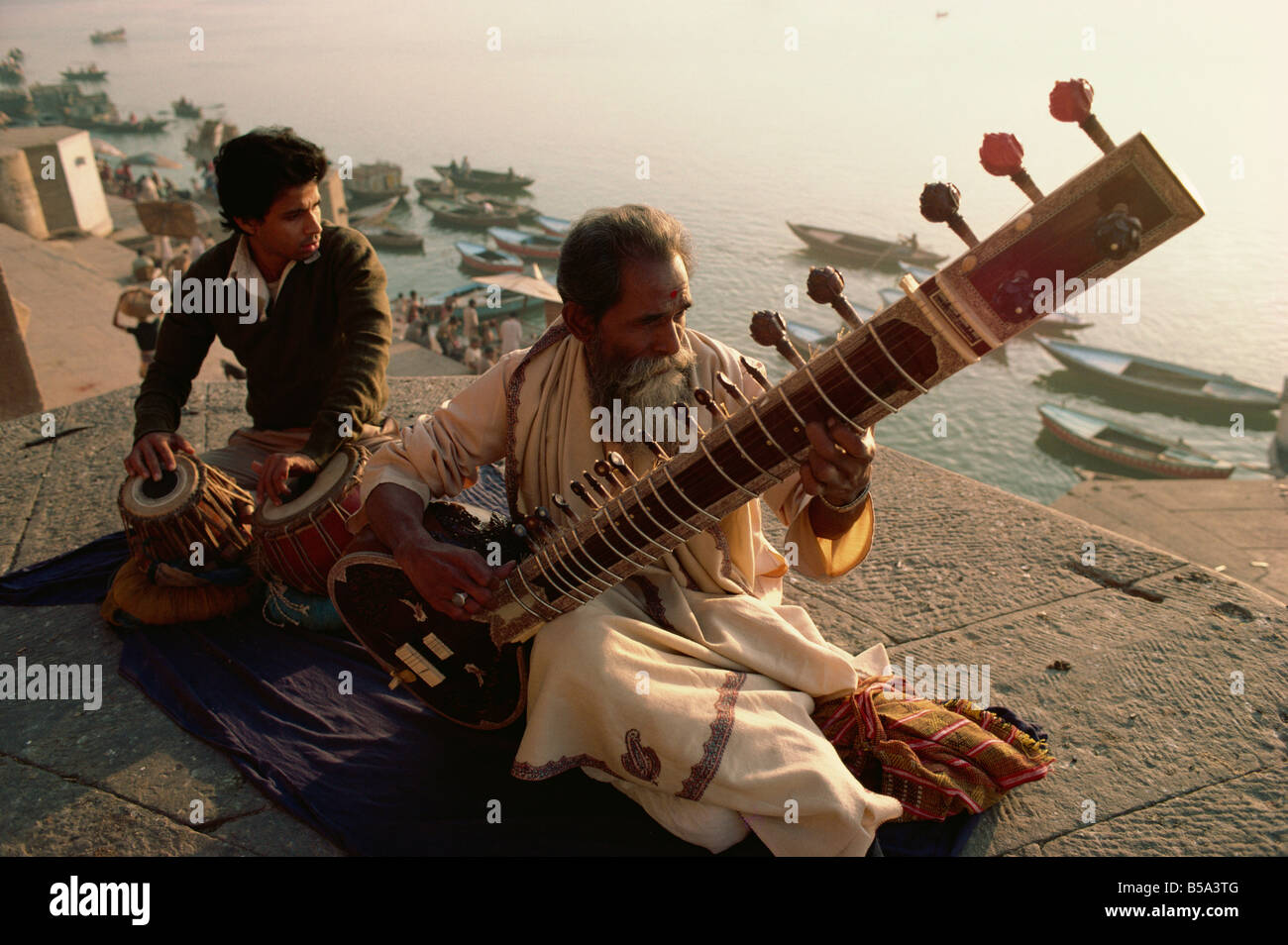 Sitar and tabla player beside the Ganga River Varanasi Uttar Pradesh