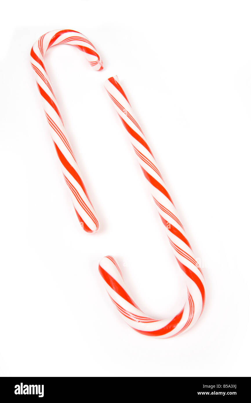 Candy canes isolated on a white studio background Stock Photo - Alamy