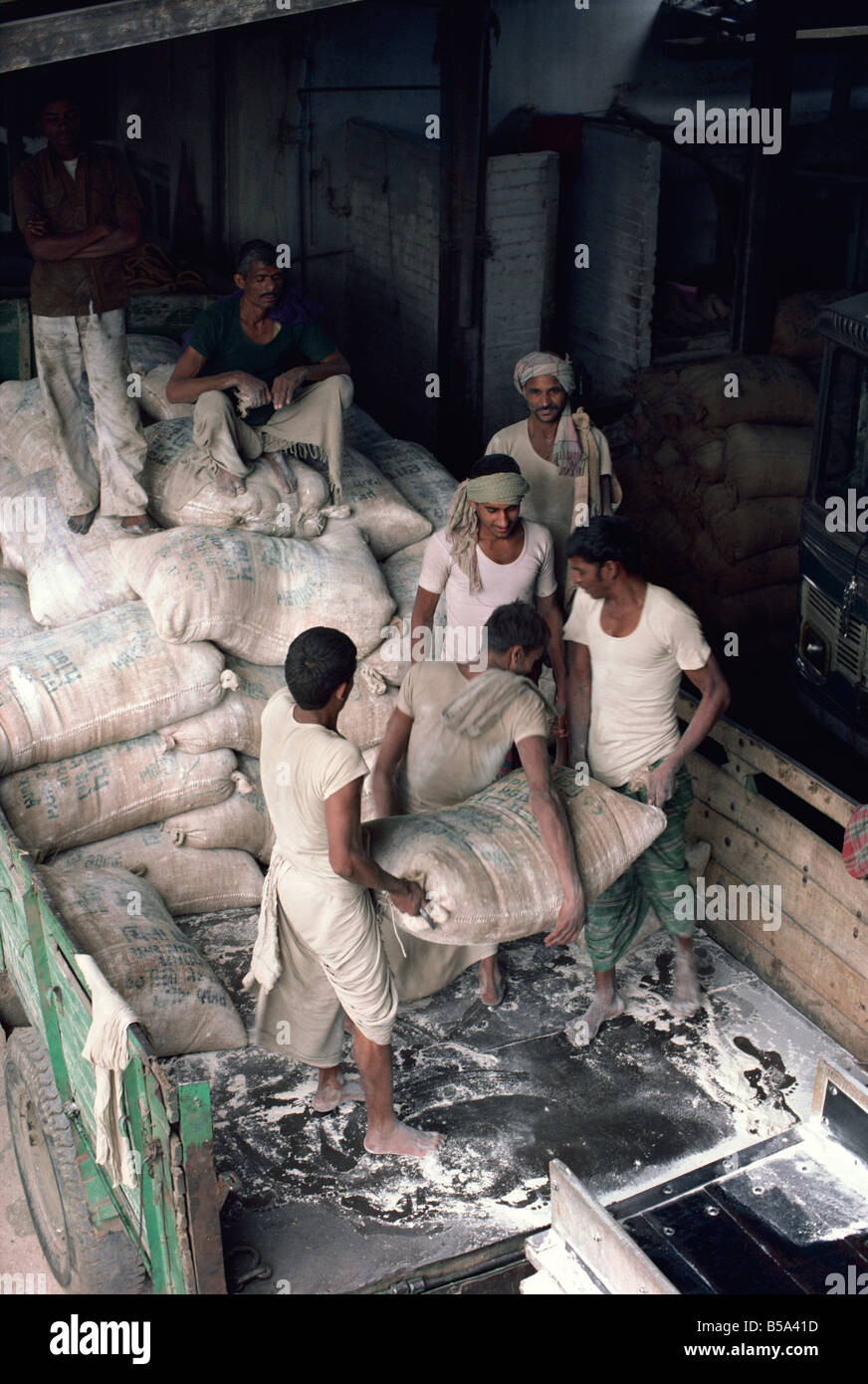 Flour mill workers Ahmedabad Gujarat state India Asia Stock Photo Alamy