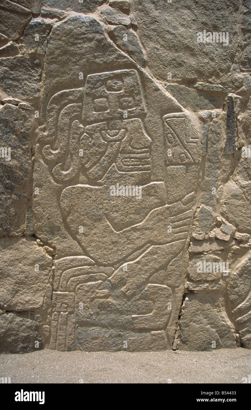 Detail of carved stone warrior relief in site of Cerro Sechín, Casma Valley, Peru Stock Photo