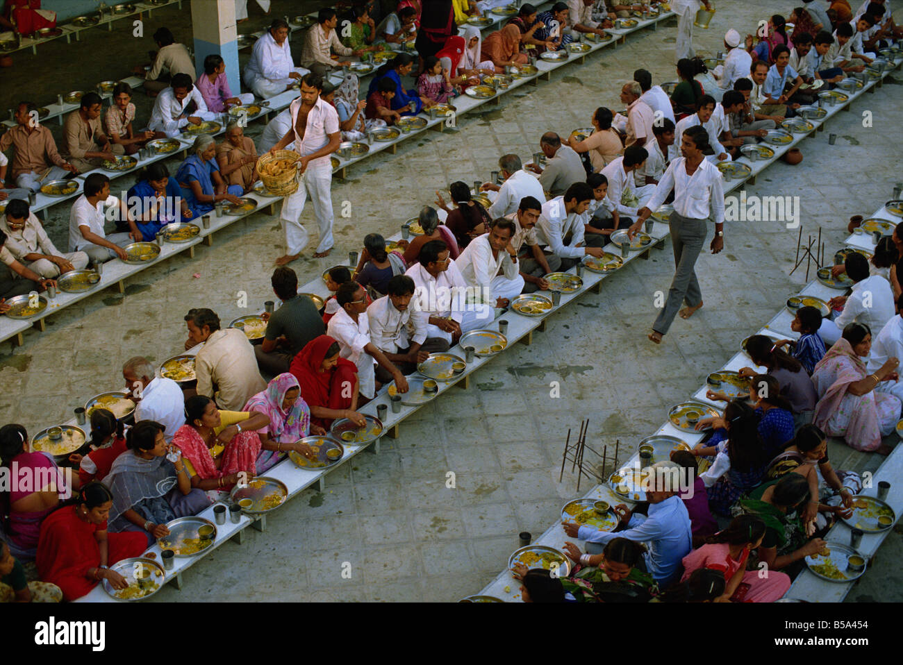 Jain pilgrims being fed en masse Palitana Gujarat state India Asia Stock Photo