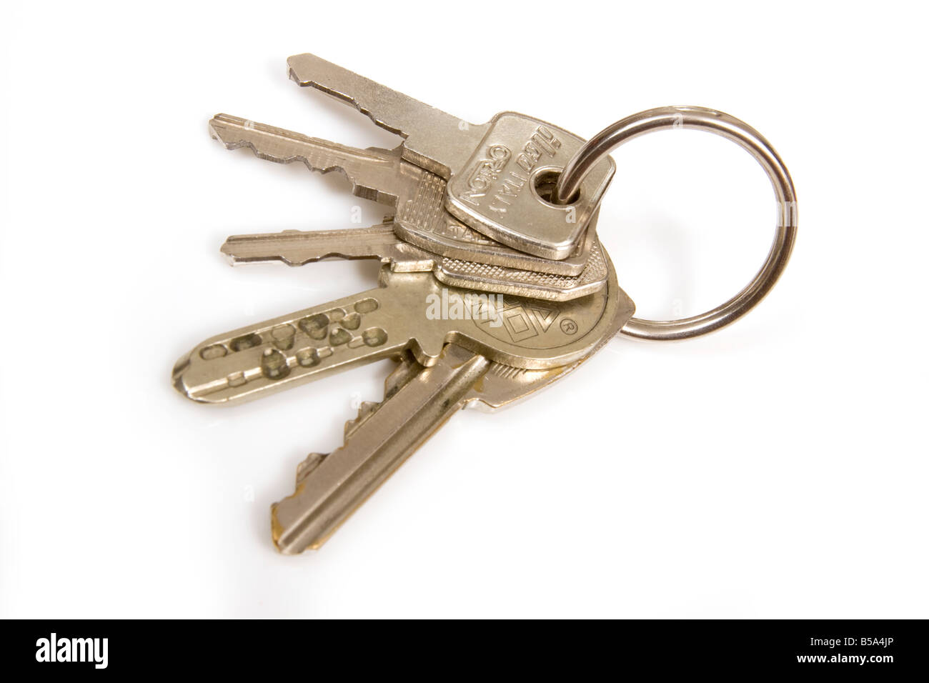 Bunch of house keys isolated on a white studio background Stock Photo
