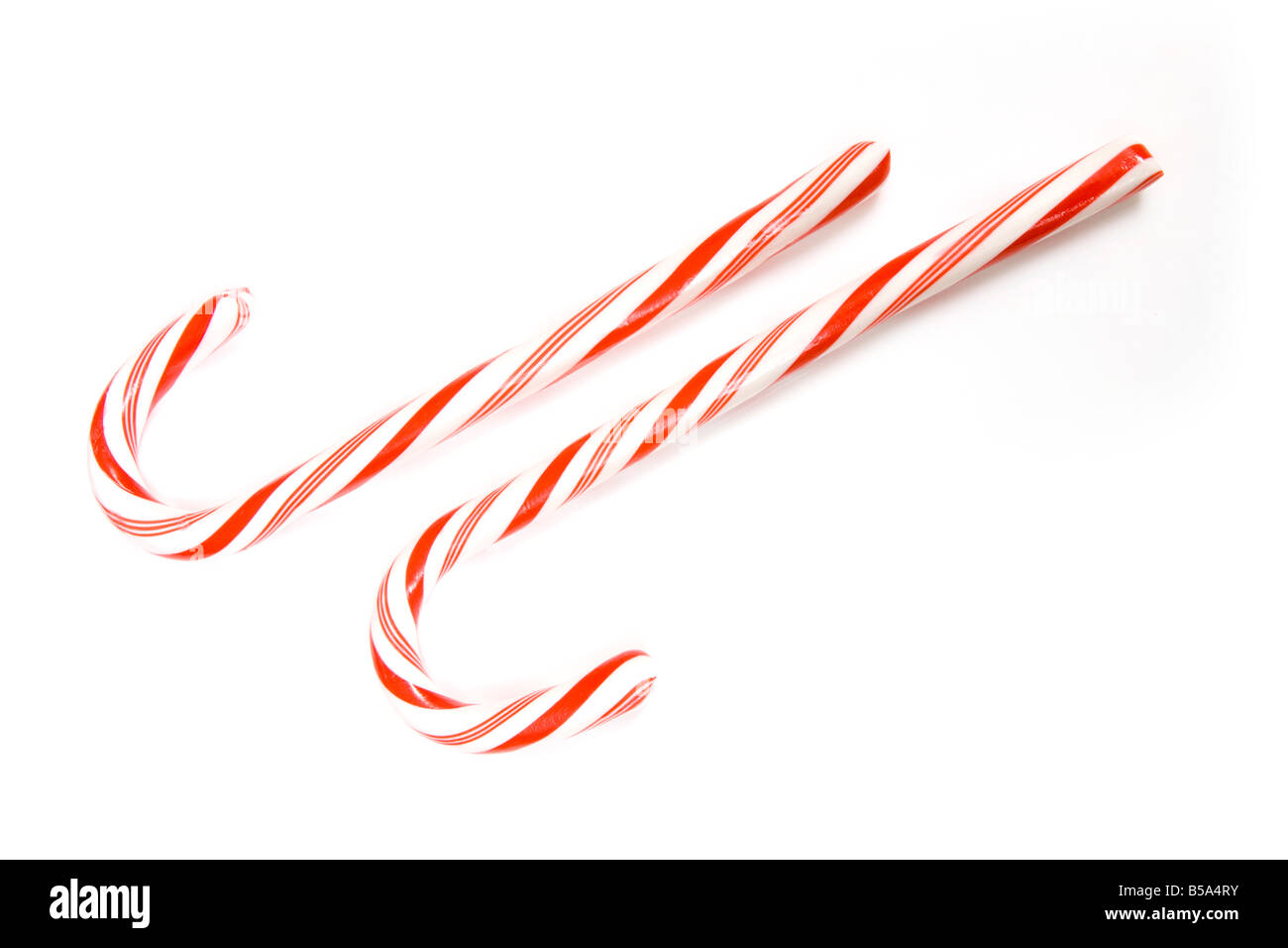 Candy canes isolated on a white studio background Stock Photo - Alamy