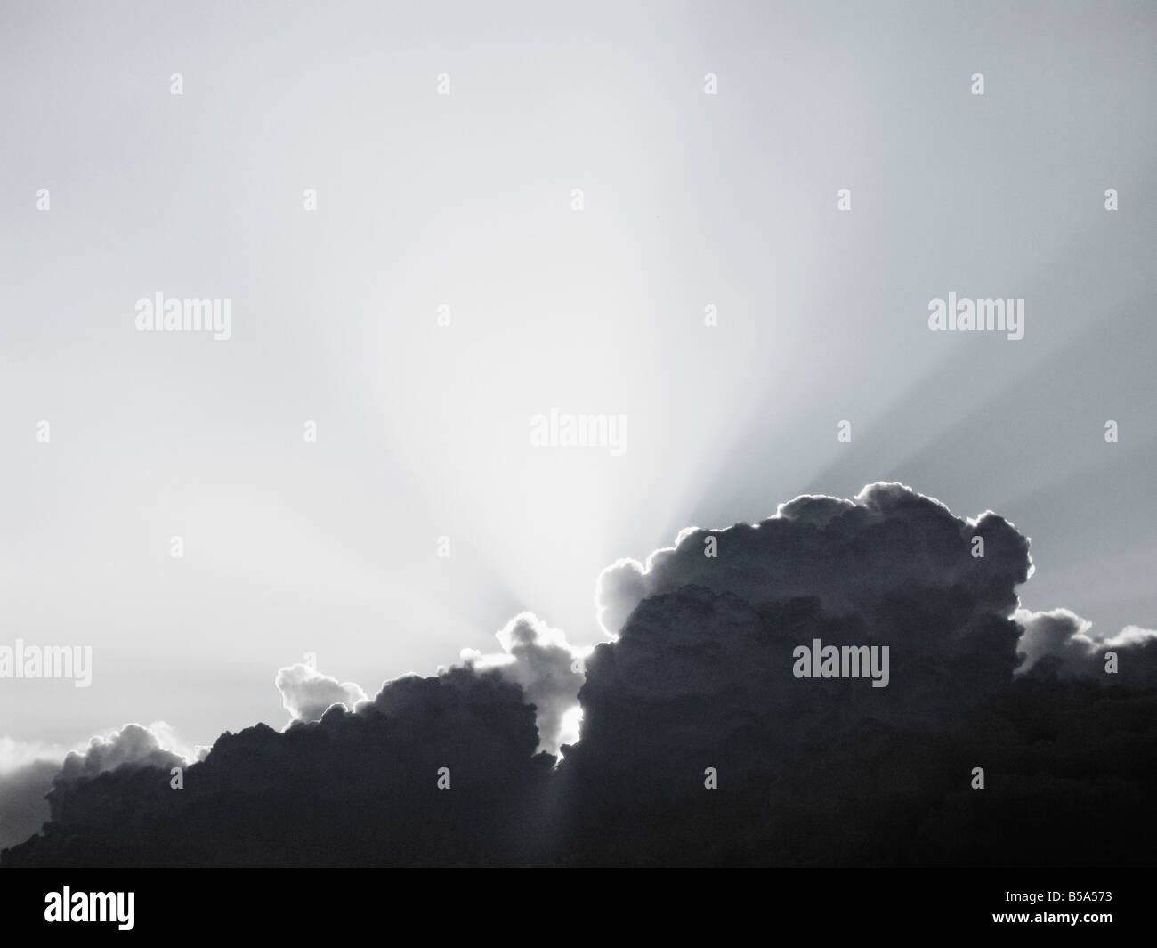 Sun Behind Dramatic Cloudscape Dusk Stock Photo