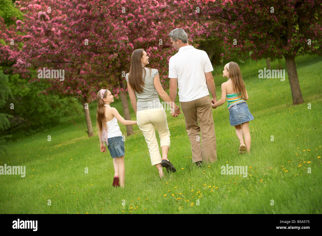 Family walking in a park Stock Photo