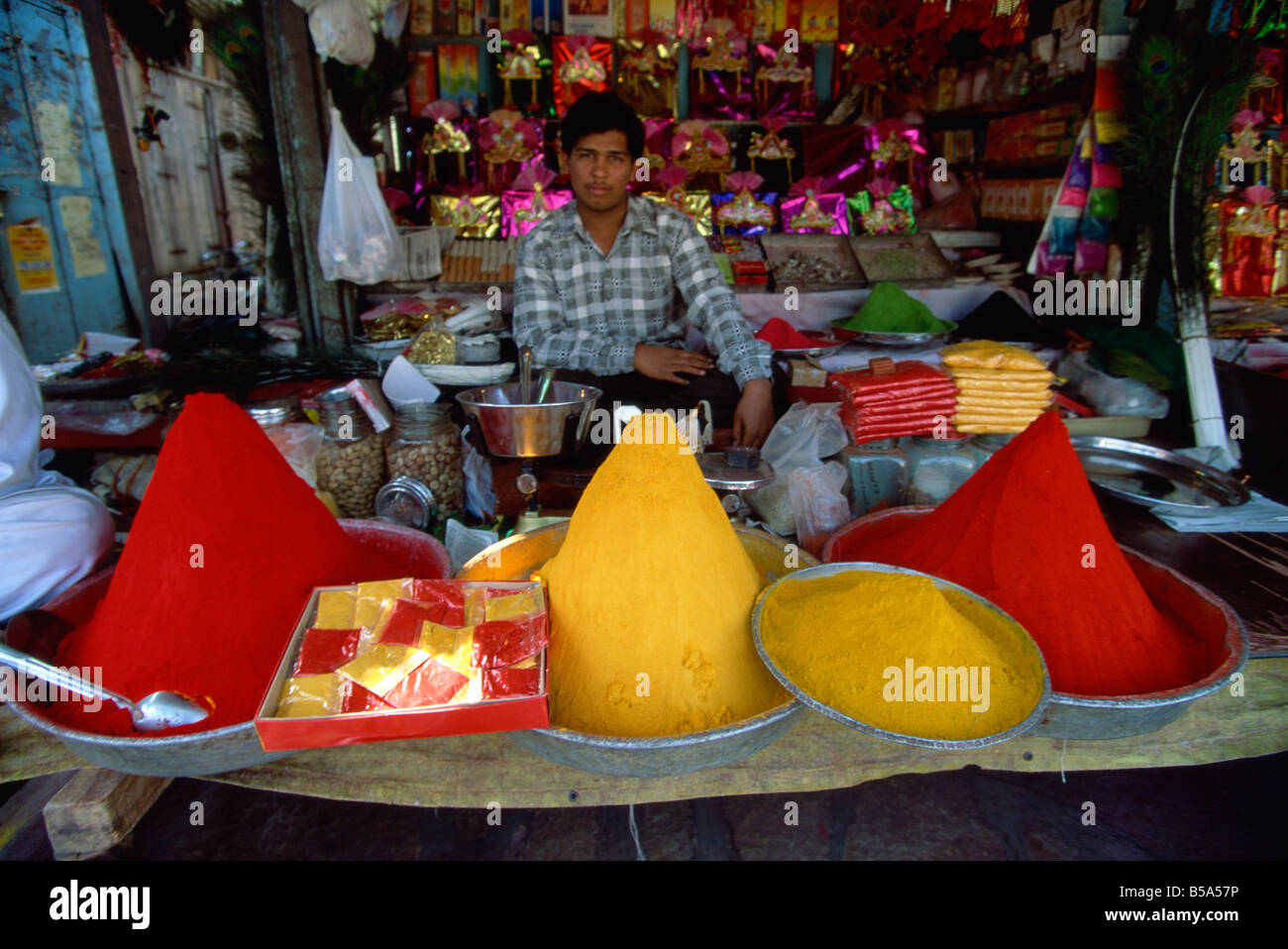 Yellow turmeric and red dye for sale, old town, Pune, Maharashtra state, India Stock Photo