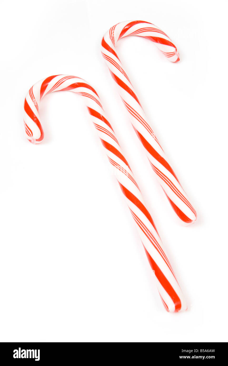 Candy canes isolated on a white studio background Stock Photo - Alamy