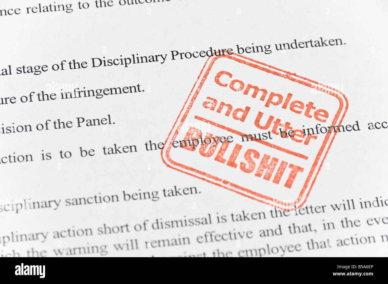Complete and utter bullshit stamp on a page containing disciplinary procedures Stock Photo