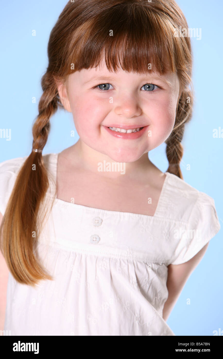 Portrait of little girl with braids Stock Photo - Alamy