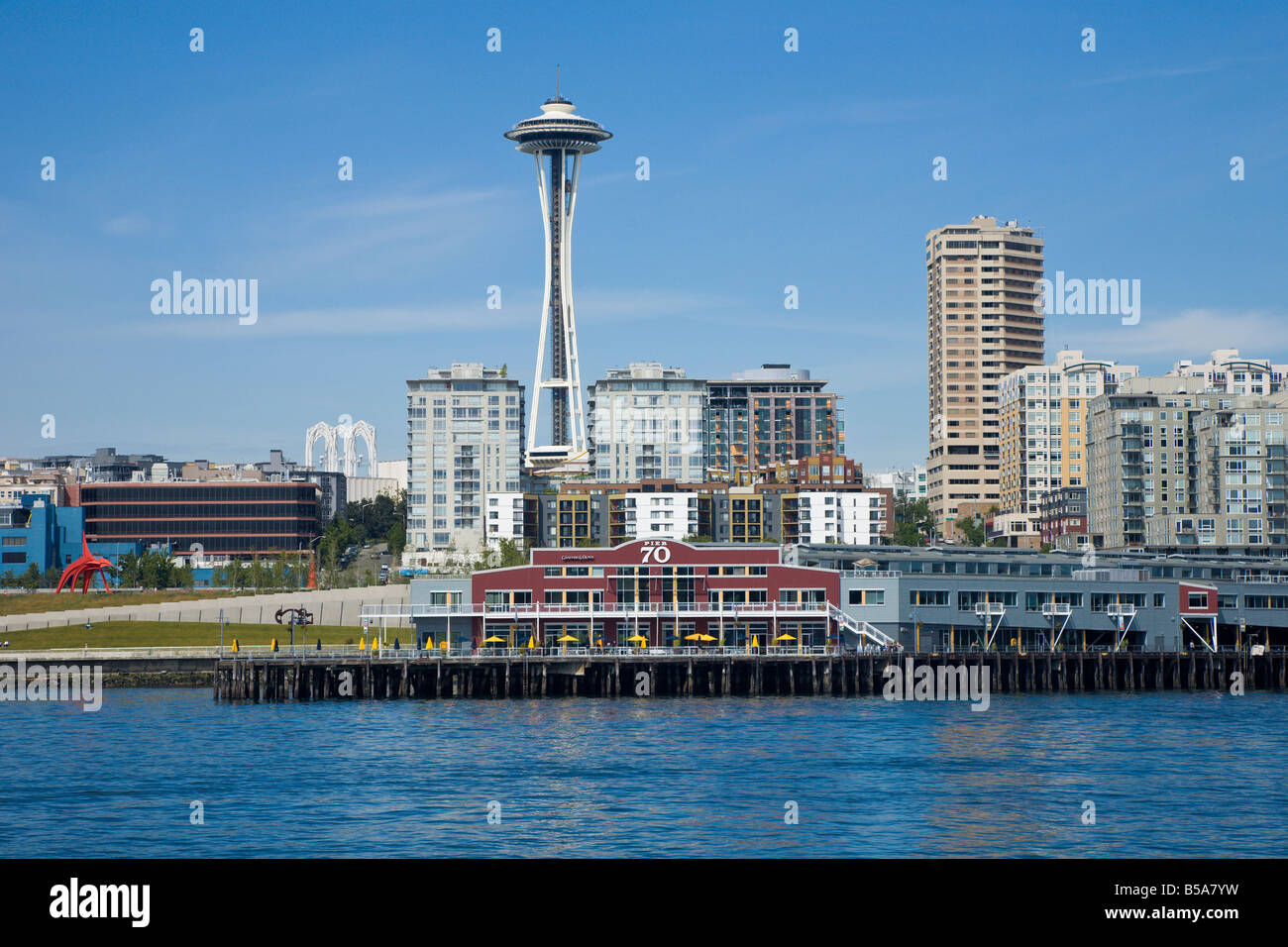 Space Needle looms over Seattle cityscape as seen from Elliot Bay Stock Photo