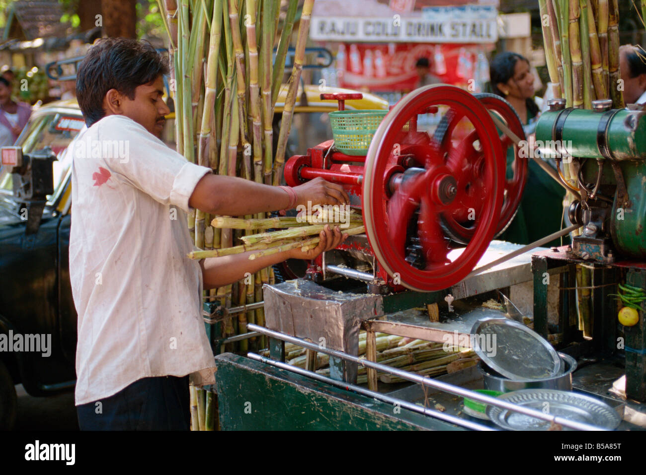 Sugar cane juicing machine Mumbai Bombay India Asia Stock Photo - Alamy