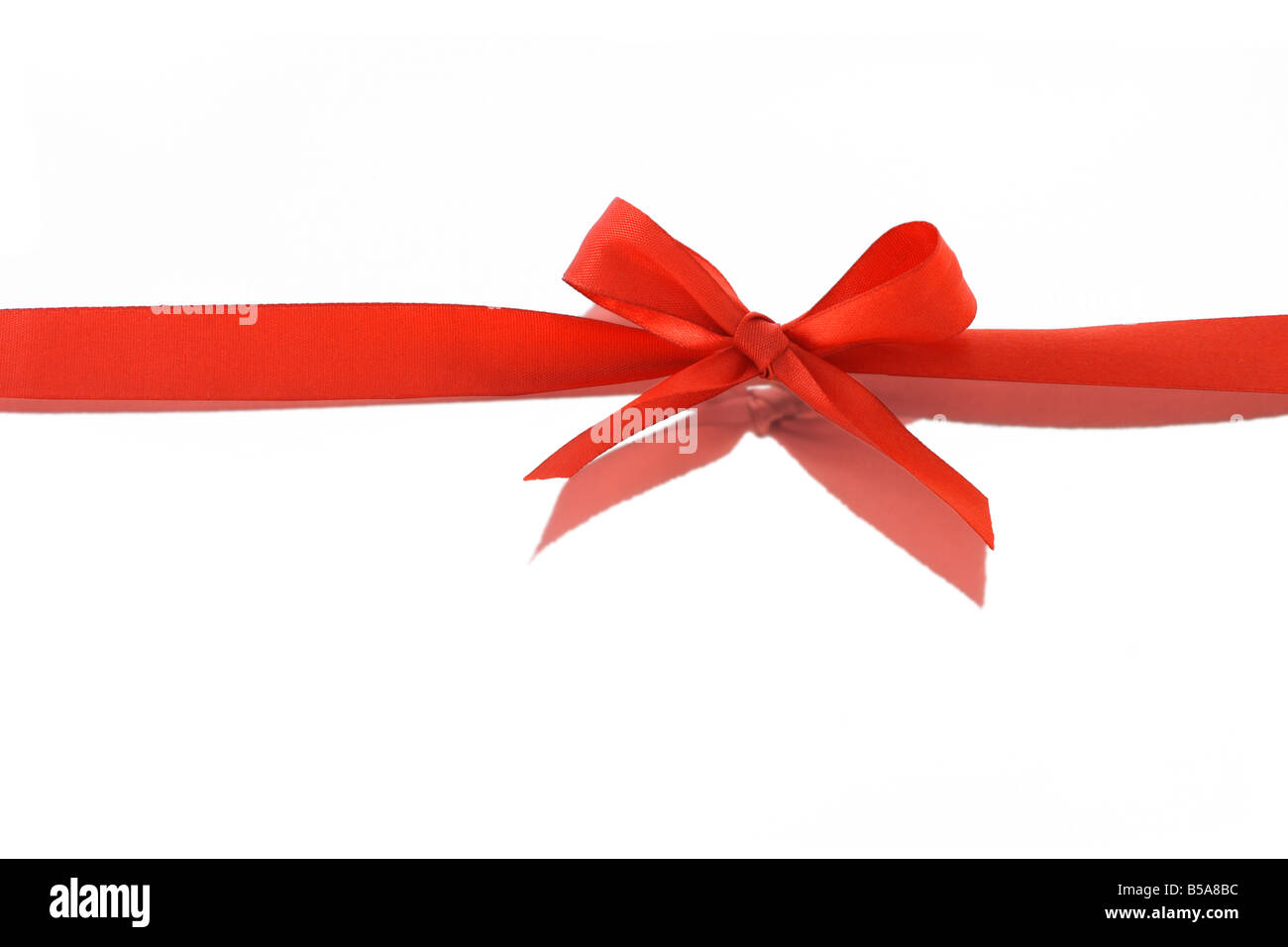 Red decorative bow ribbon and reflection on white background Stock ...
