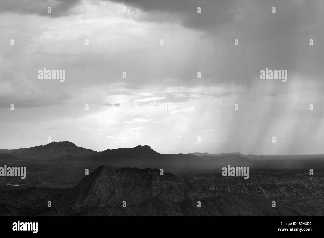 aerial view above rain showers over Ciudad Juarez Mexico at the Texas border Stock Photo