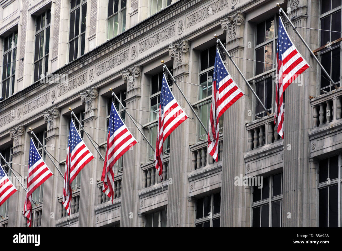 American flags in Saks Company Building on Fifth Avenue in Manhatten ...