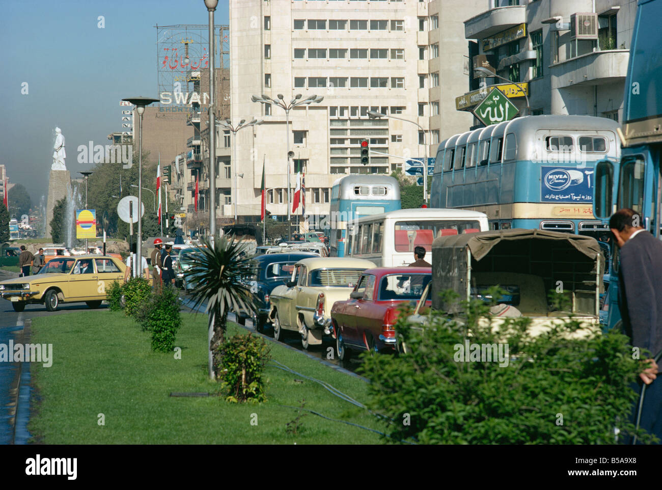 Street scene pre Revolution with traffic in the city of Tehran Iran
