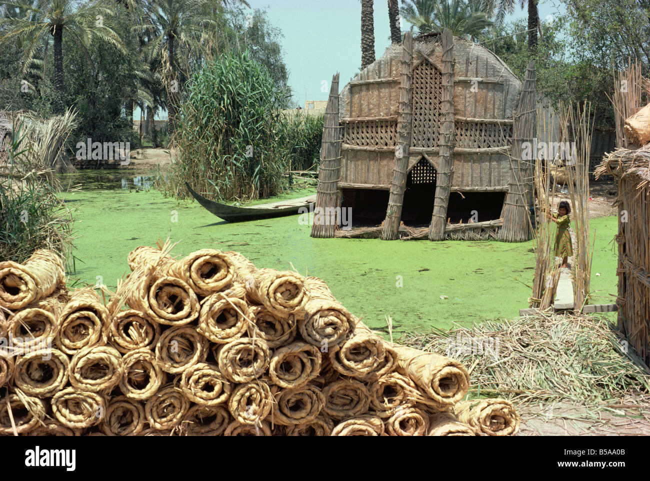 Mudhif' meeting house and reed mats ready for sale, Chobaish Marshes, Iraq, Middle East Stock Photo