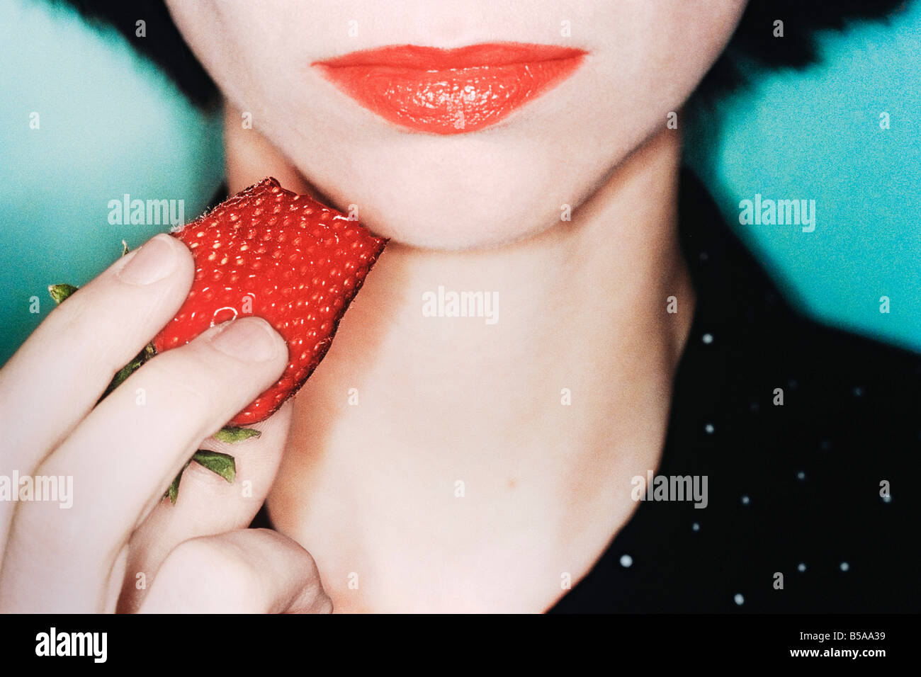 Woman Eating Strawberry Extreme Close up Stock Photo
