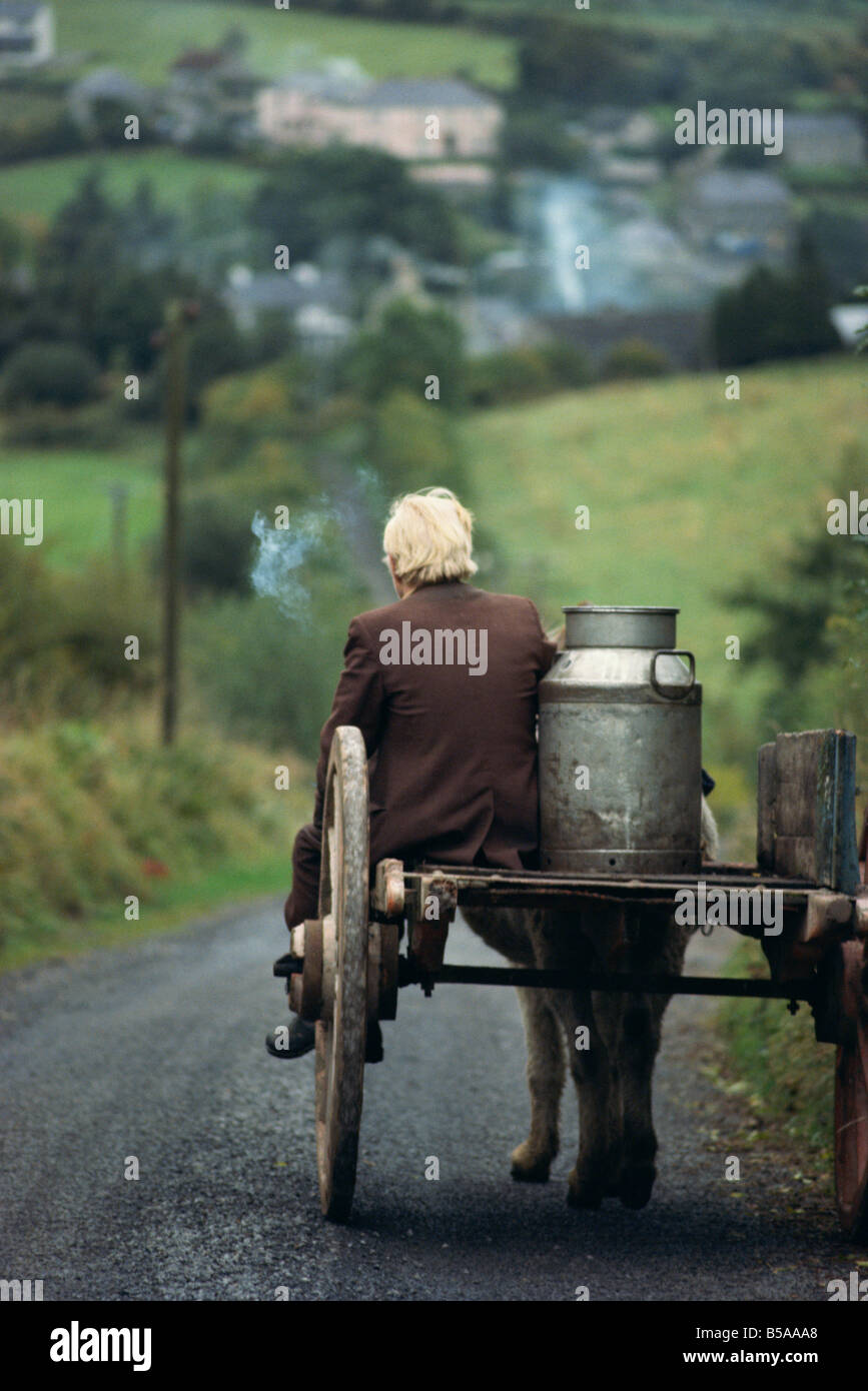 Figure riding cart with milk churn, Arigna, Shannon River, County Leitrim, Connacht, Republic of Ireland, Europe Stock Photo