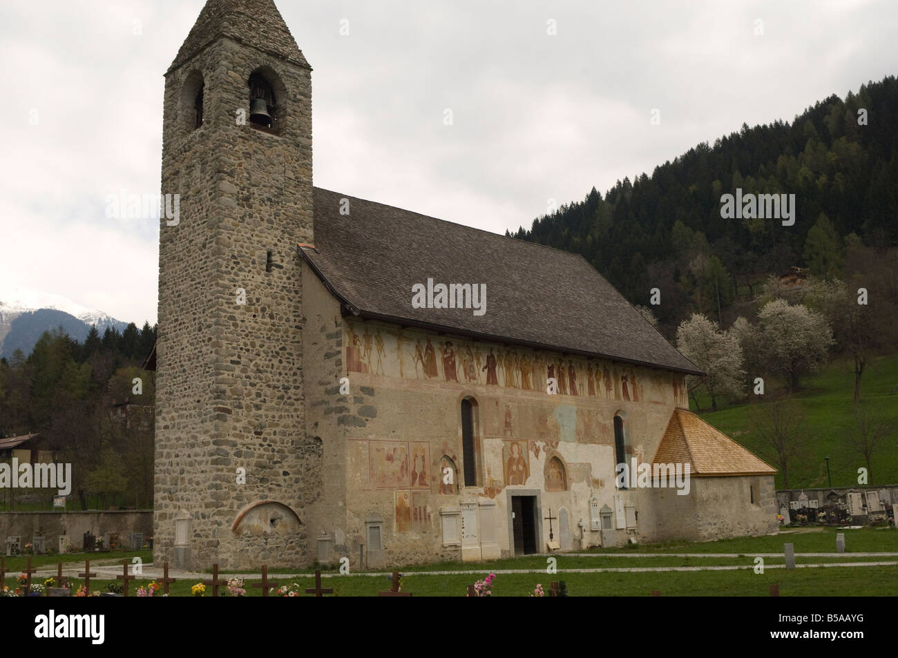 Wall frescoes on the exterior of the ancient church of Chiesa di Vigilio, Pinzolo, Trentino-Alto Adige, Italy, Europe Stock Photo