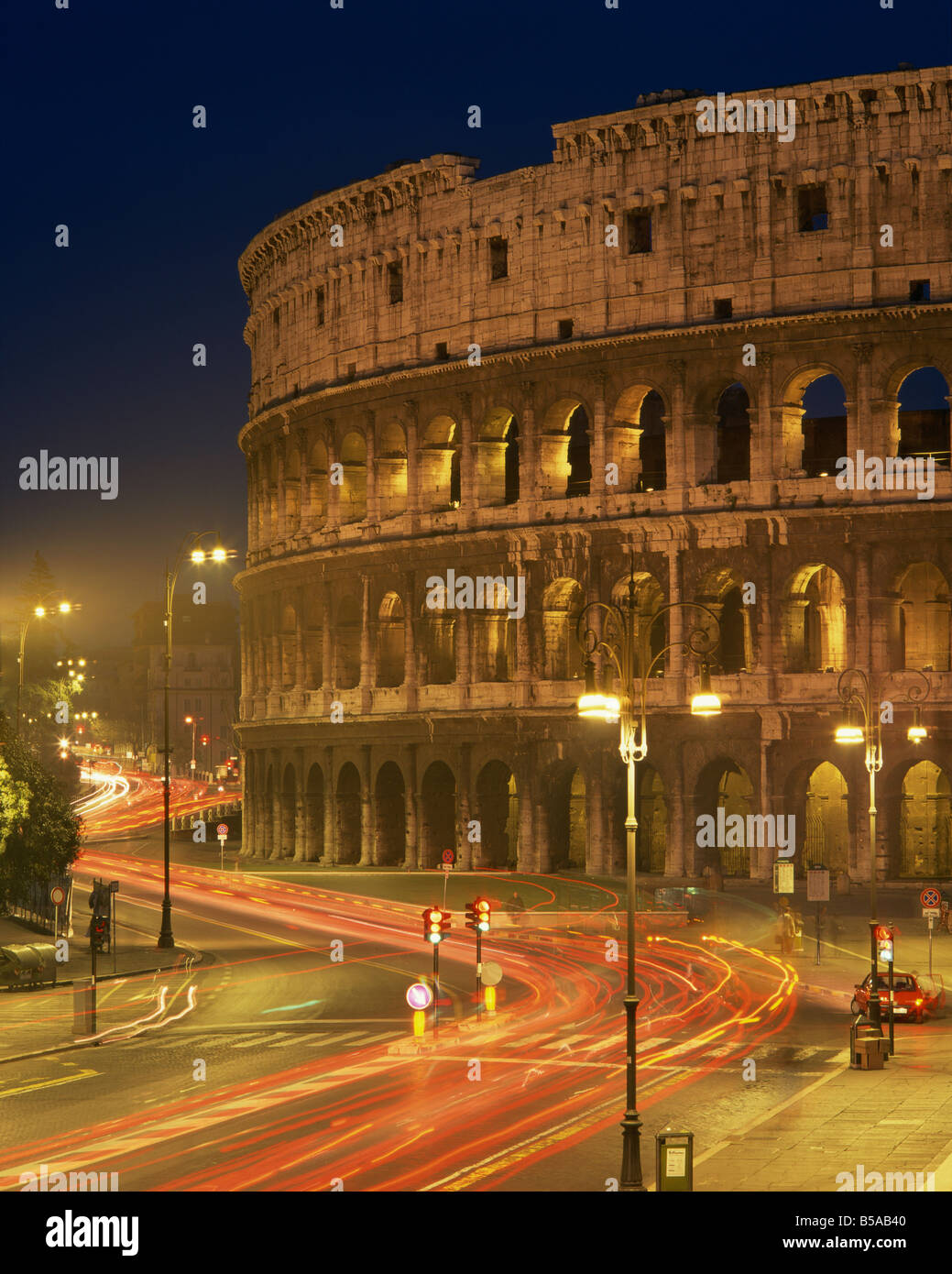 The Colosseum illuminated at night in Rome Lazio Italy Europe Stock Photo
