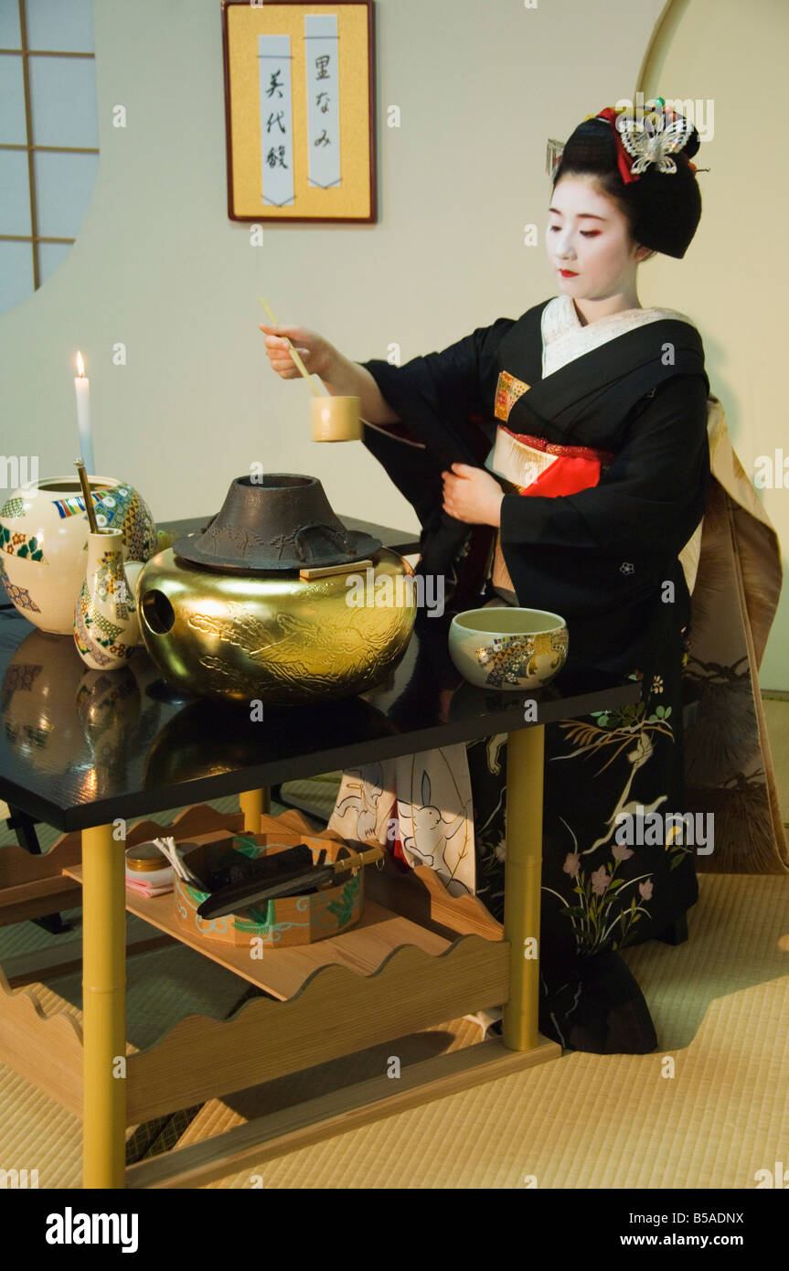 Tea ceremony by a Maiko trainee geisha Kyoto Honshu Island Japan Asia Stock Photo