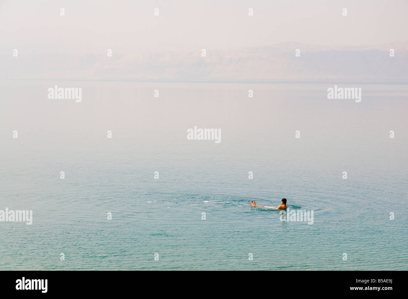 Man swimming in the Dead Sea, Jordan, Middle East Stock Photo