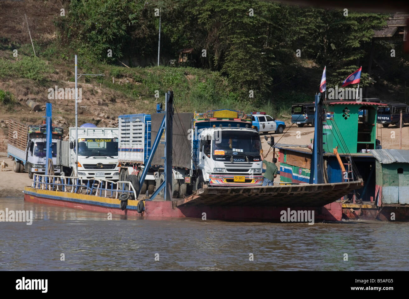 Ferry from Thailand crossing the Mekong River towards Laos, Southeast Asia Stock Photo