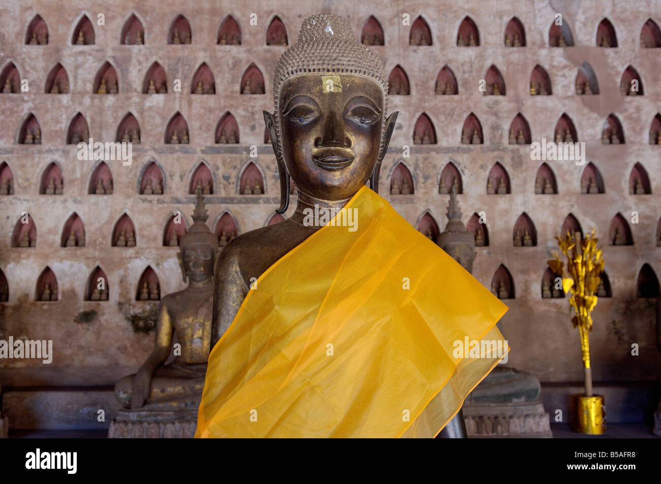 Buddha statue in the gallery or cloister surrounding the Sim, Wat Sisaket, Vientiane, Laos, Indochina, Southeast Asia Stock Photo