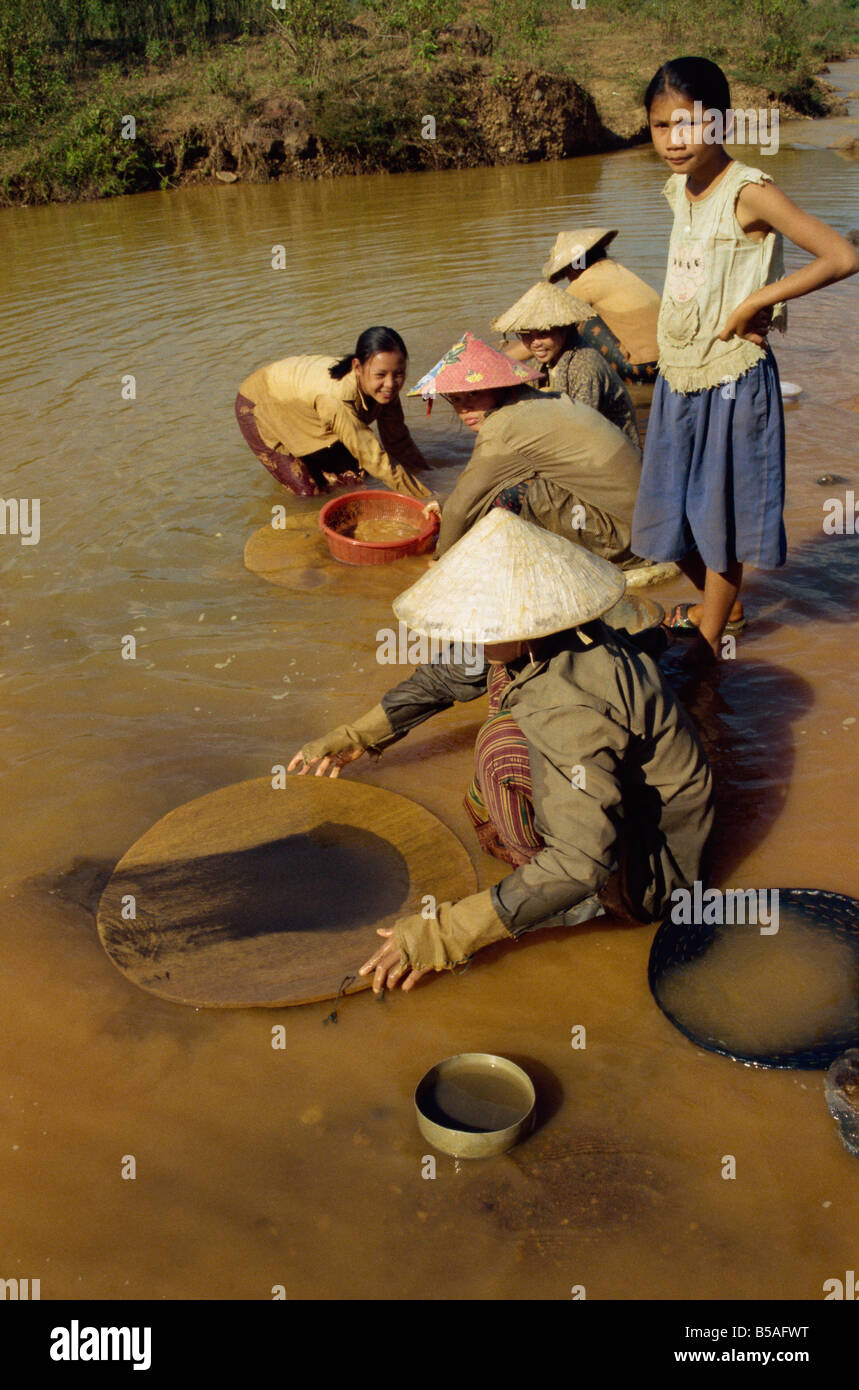 Women panning for black tin oxide Pathene basin Phontiou tin mine Khammouan province Laos Indochina Southeast Asia Asia Stock Photo