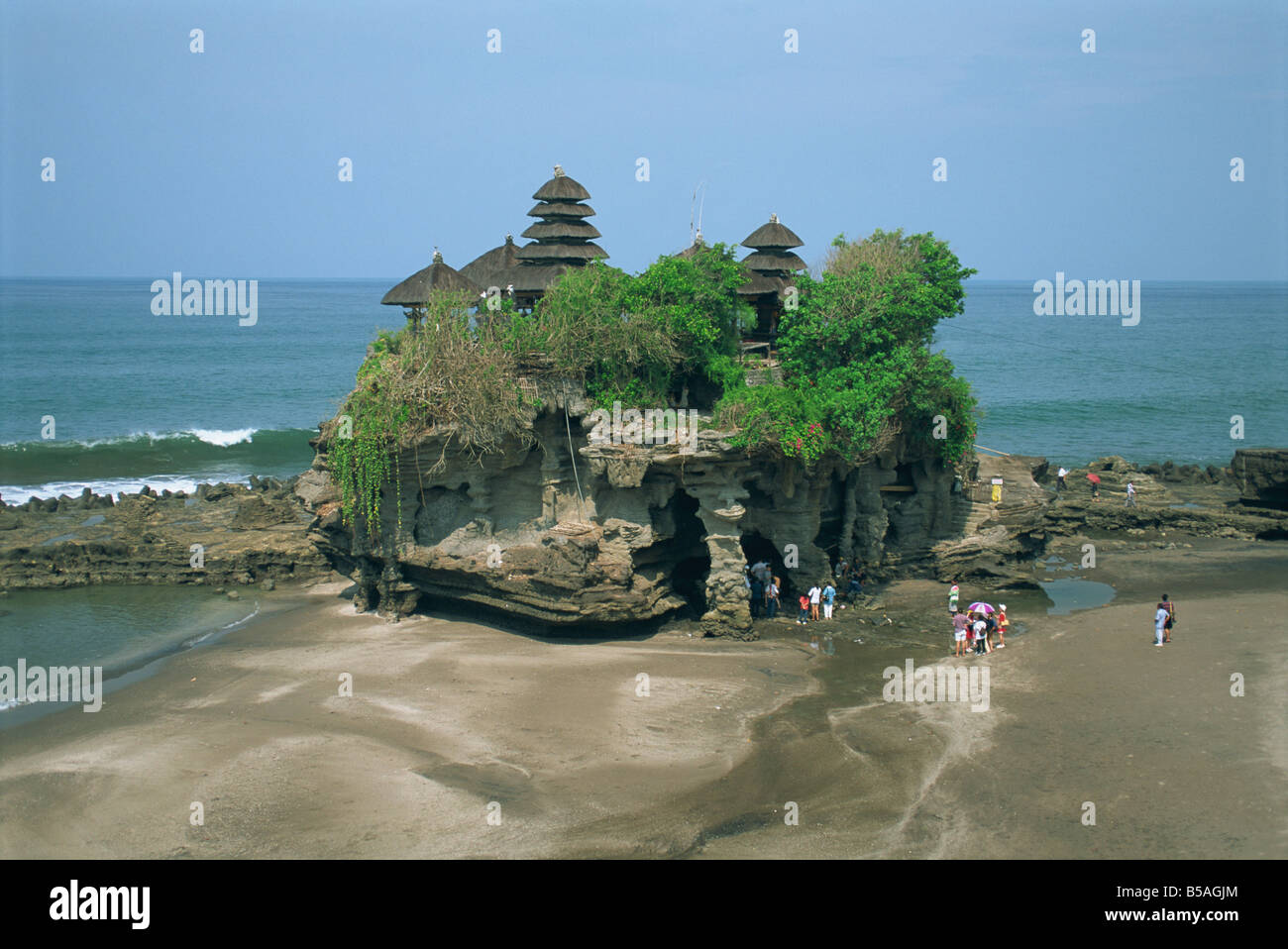 A group of tourists visit the Tanalot Temple on the island of Bali Indonesia Asia G Hellier Stock Photo
