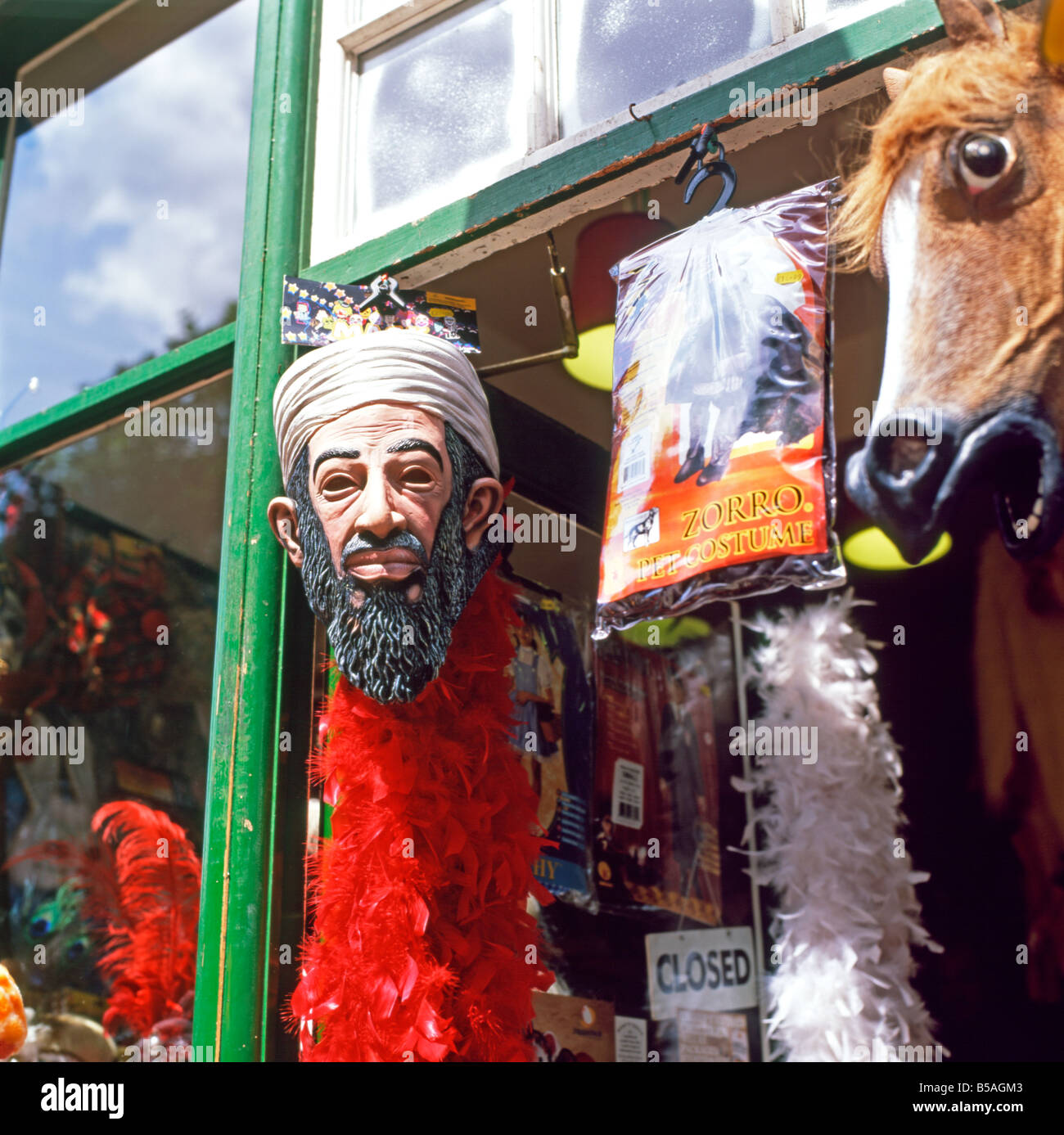 An Osama bin Laden Halloween mask hanging in a joke shop window by Spitalfields Market in East London England UK  KATHY DEWITT Stock Photo