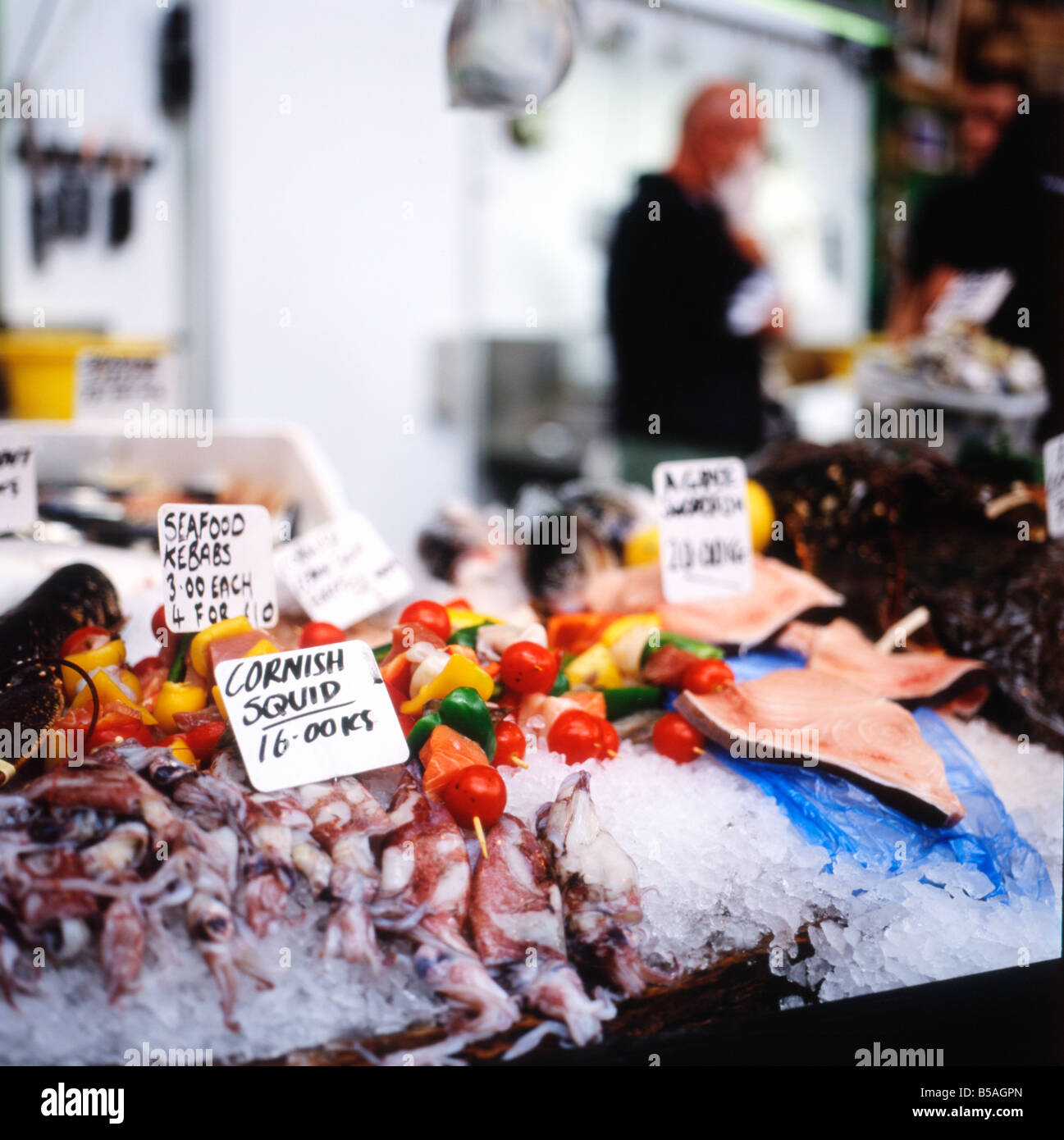 Cornish squid on a bed of ice for sale on a fresh fish seafood stall at Borough Market London Bridge Southwark in London England UK    KATHY DEWITT Stock Photo